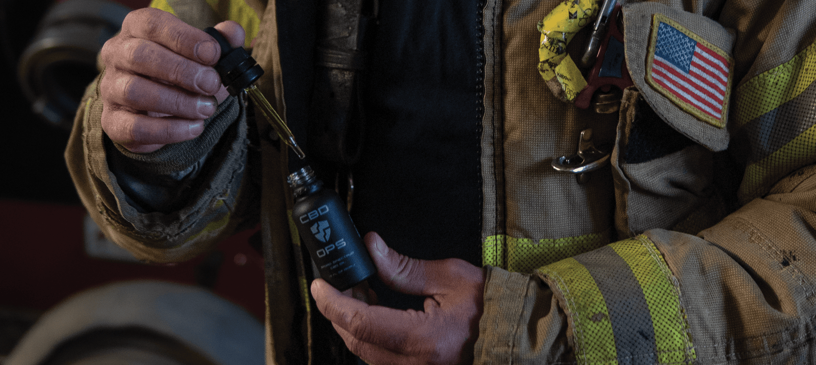 Firefighter taking CBDOps CBD tincture oil created to provide CBD for first responders.
