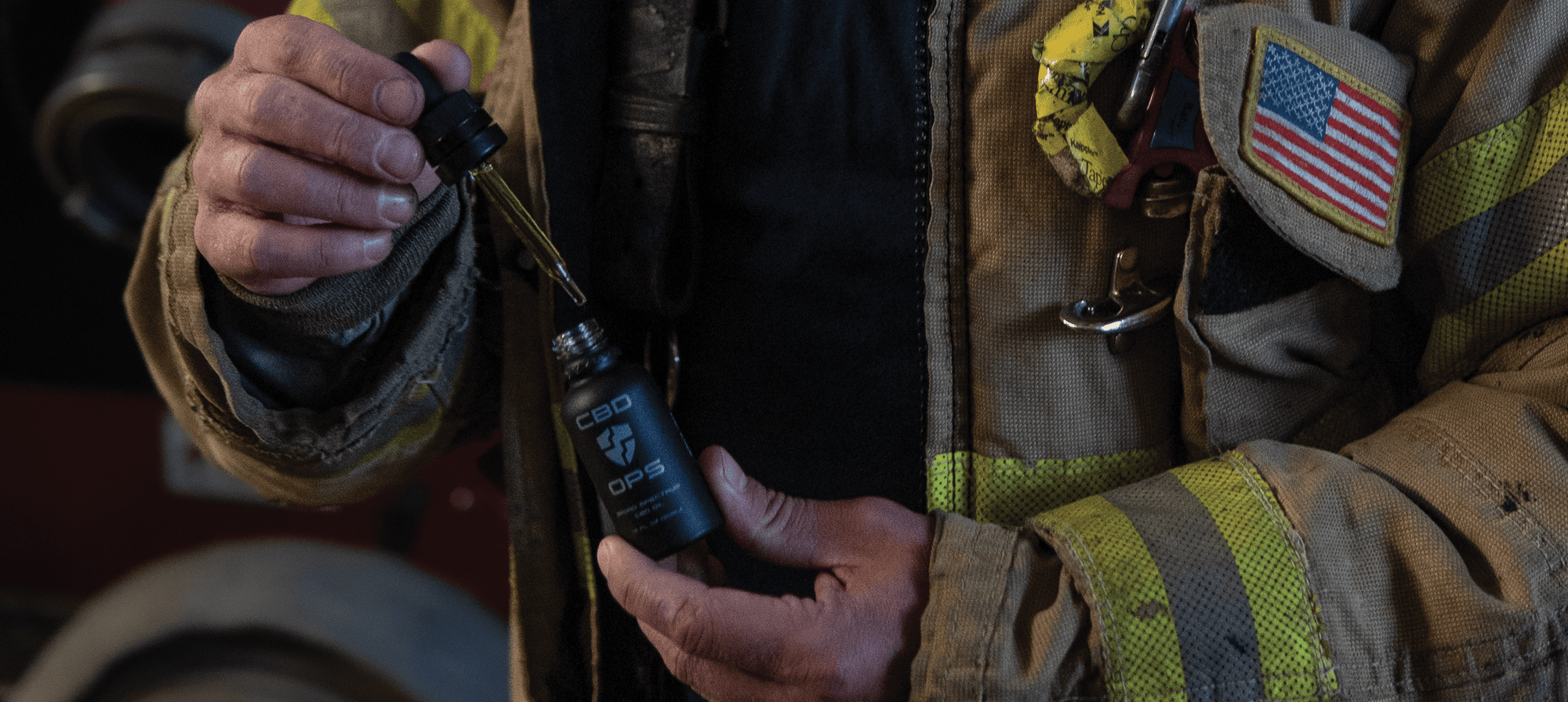 Firefighter taking CBDOps CBD tincture oil created to provide CBD for first responders.