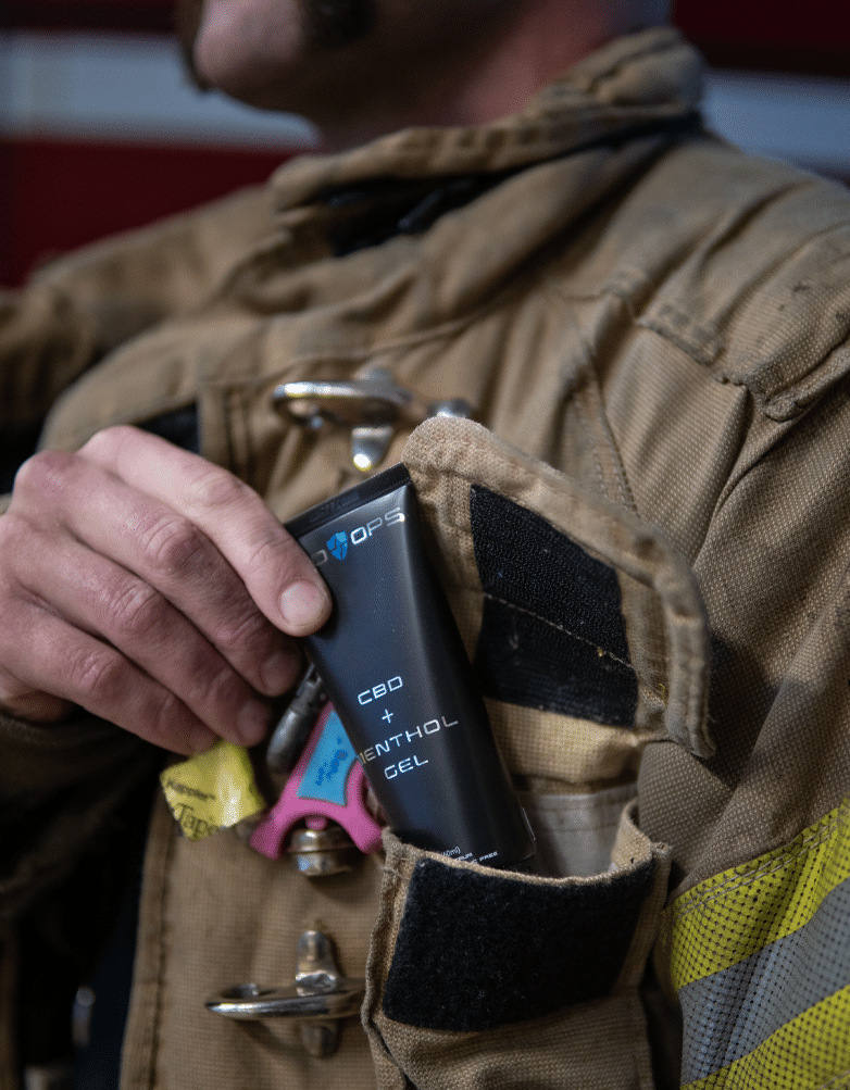 Firefighter with CBDOps CBD and methanol cooling gel product.